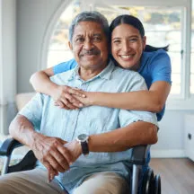caregiver and senior smiling