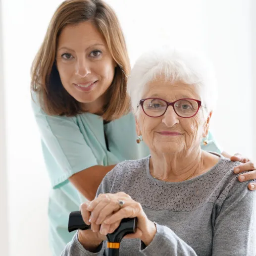 caregiver and senior smiling
