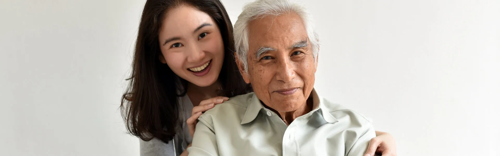 senior and caregiver smiling