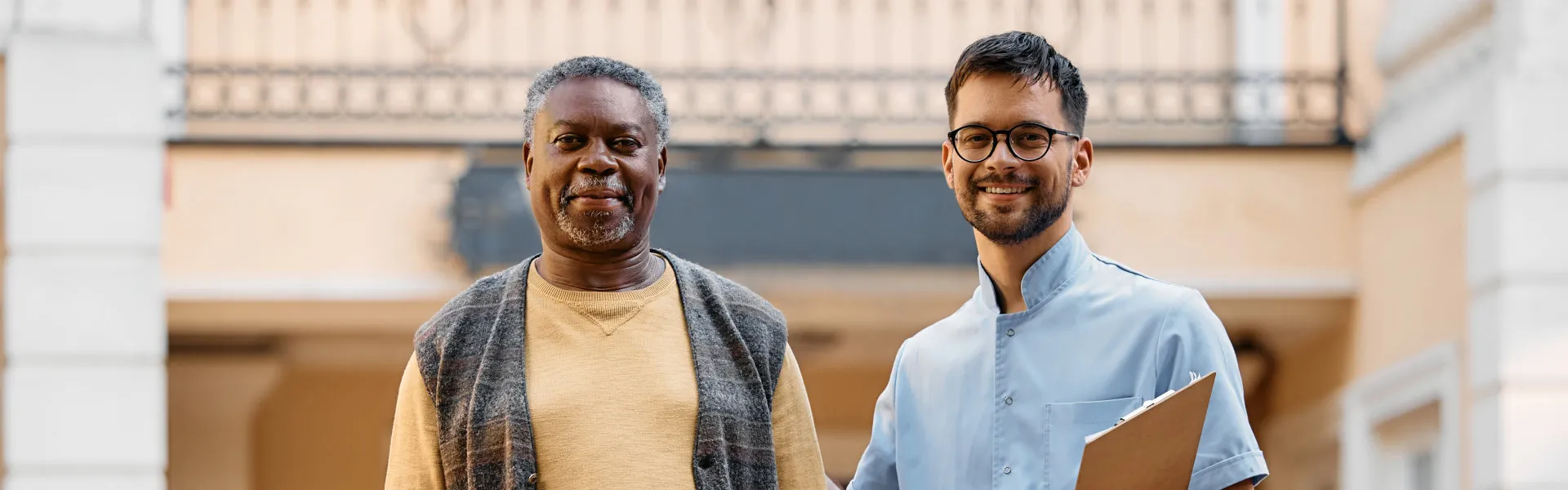 senior and caregiver smiling