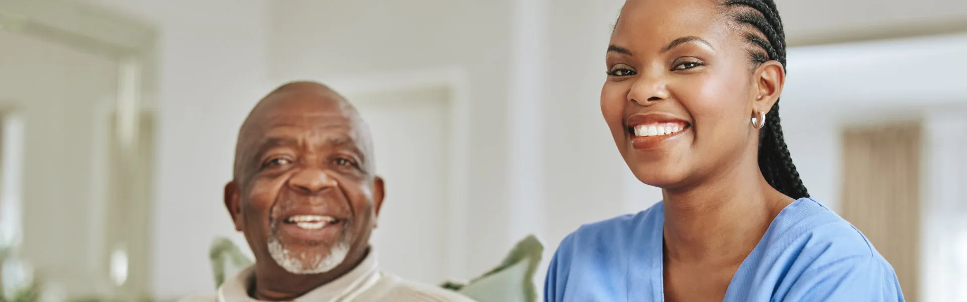 senior and caregiver smiling