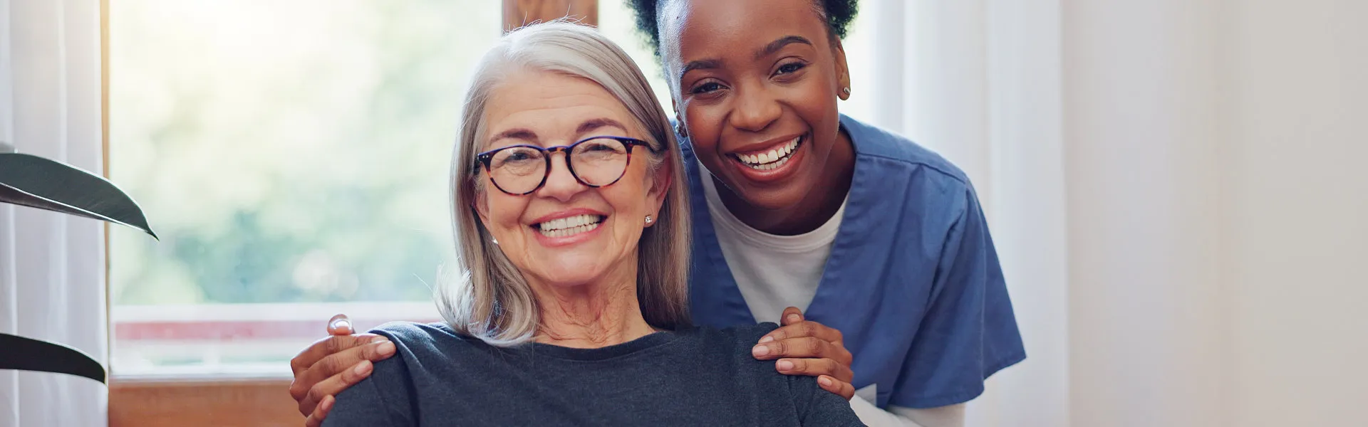 senior and caregiver smiling